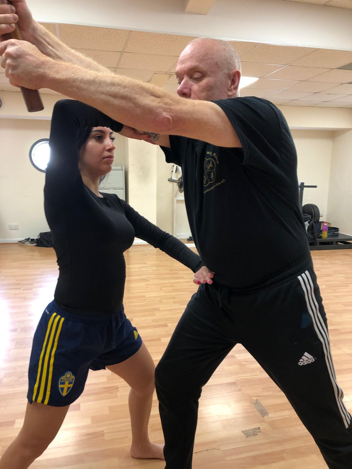 Defending against a downward sword strike